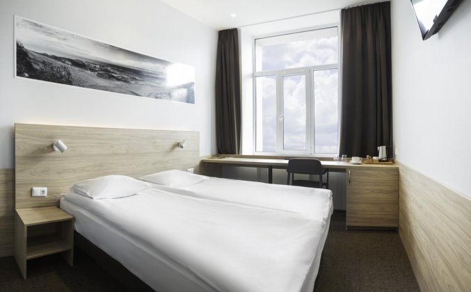 Standaard tweepersoonskamer met tweepersoonsbed van hotel Corner stedentrip Vilnius