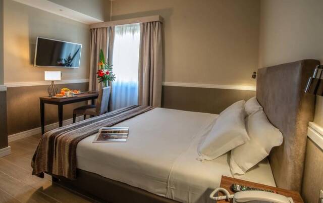 Slaapkamer van Fragrance Hotel St. Peter in Rome
