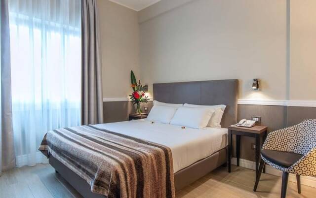 Slaapkamer van Fragrance Hotel St. Peter in Rome