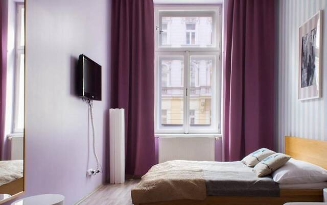 Slaapkamer van Appartementen Royal Court Legerova in Praag