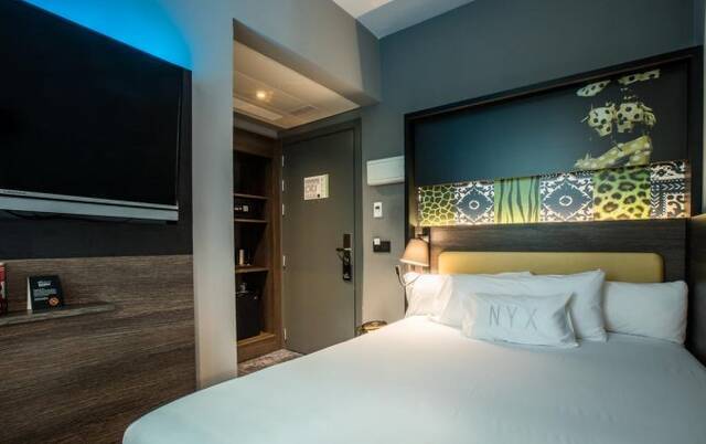 Slaapkamer van hotel NYX in Madrid