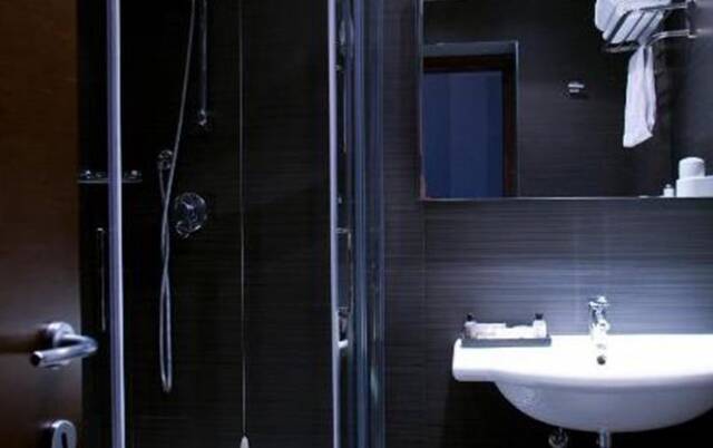 Badkamer van een tweepersoonskamer van C-Hotels Club in Florence