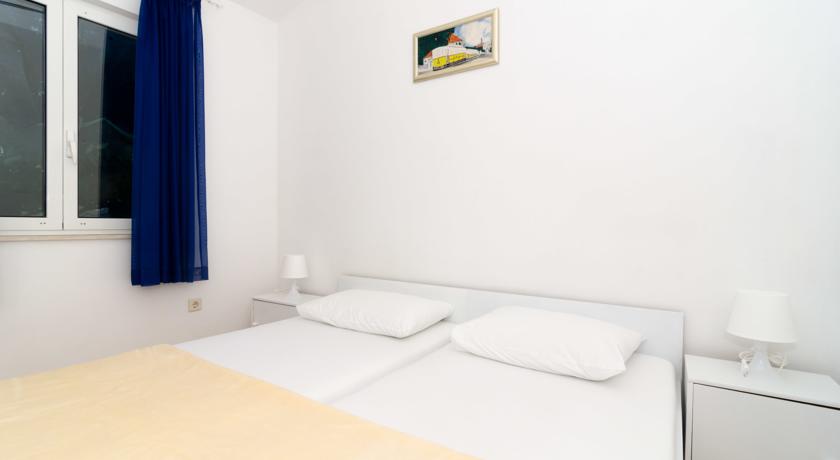 Slaapkamer van een appartement van Aparthotel Apartmani Vulicevic in Dubrovnik