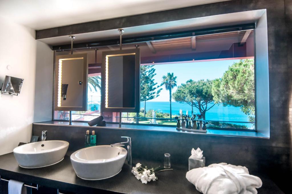 Boutique Hotel Miranda - badkamer met zeezicht